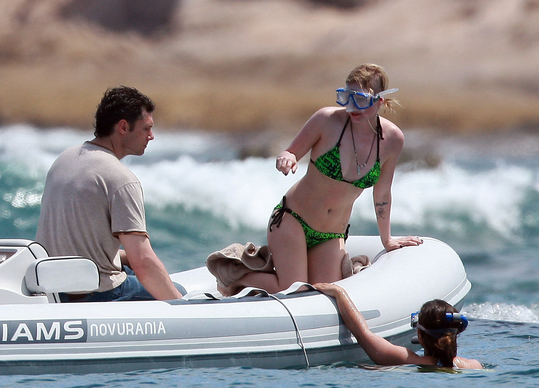 Avril Lavigne in a green bikini in Cabo, Mexico on July 27, 2012. 