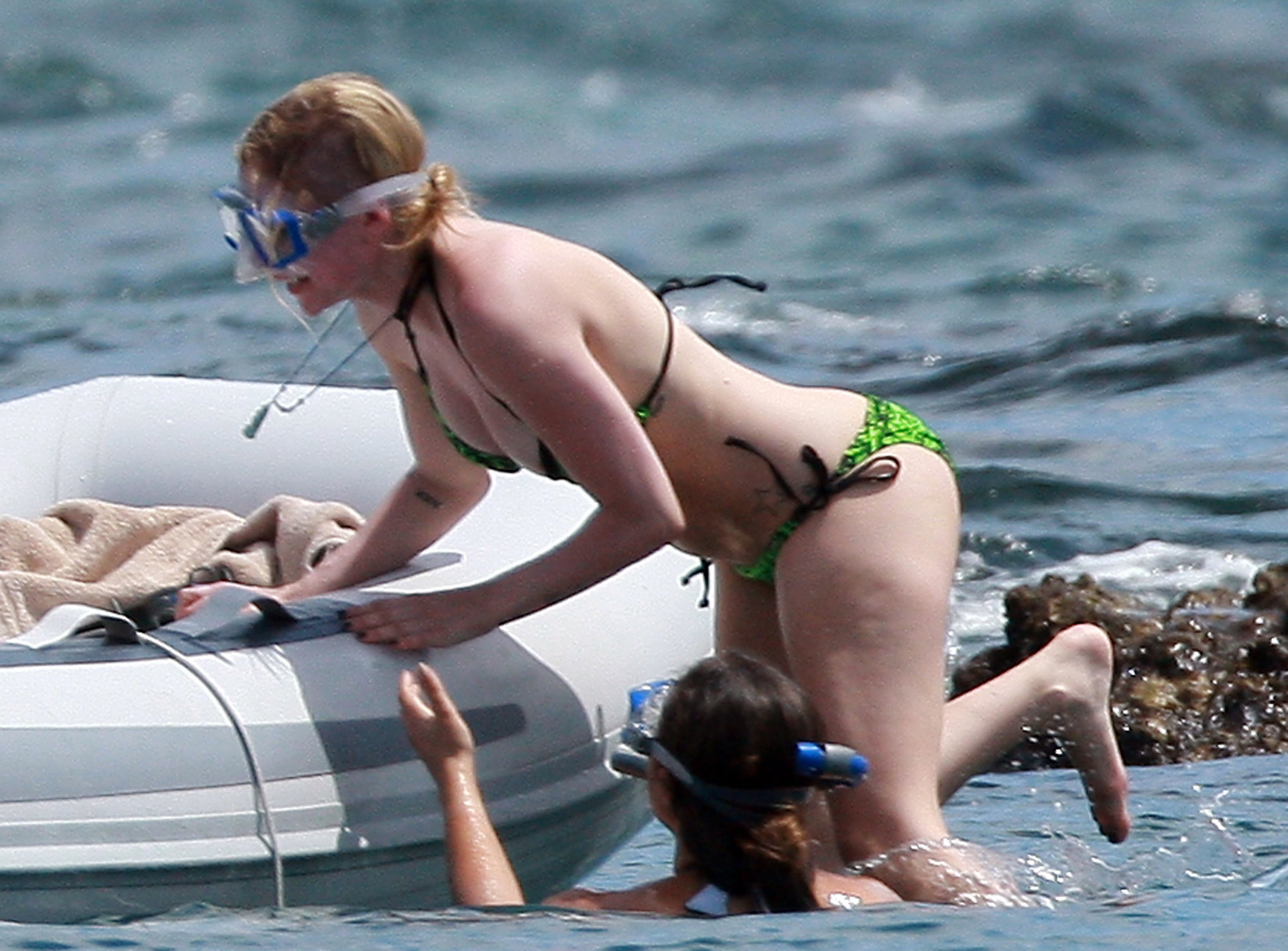 Avril Lavigne in a green bikini in Cabo, Mexico on July 27, 2012