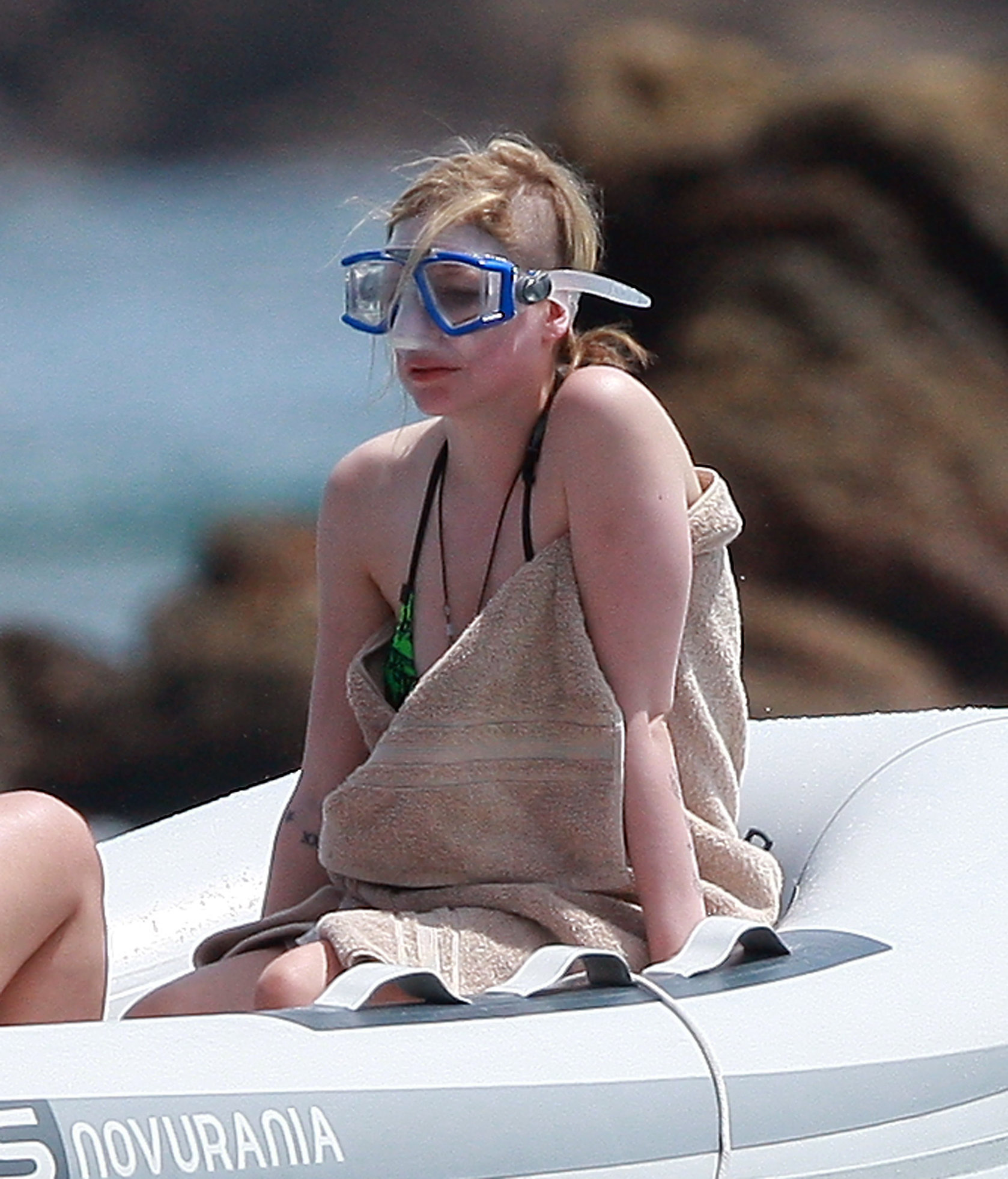 Avril Lavigne in a green bikini in Cabo, Mexico on July 27, 2012