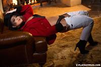 Playboy Cybergirl Chelsie Aryn poses in front of a fire place wearing a top hat