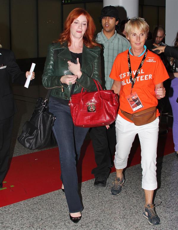 Christina Hendricks - Arriving on a flight at the Toronto International Airport - September 5, 2012