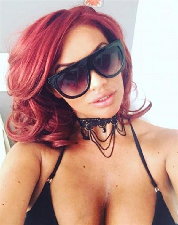 Amy Childs in a bikini taking a selfie