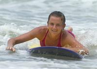 Daniela Hantuchova bikini beach surfing candids in Brisbane, Australia, December 26, 2012 