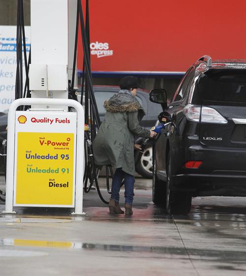 Dannii Minogue Pictures Dannii Minogue - Pictured getting a little wet while filling up on petrol - 09th August 2012