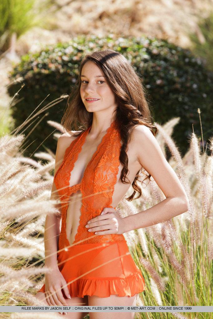 Rylee Marks takes off her orange dress for Met-Art
