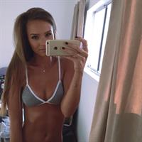 Helen Owen in a bikini taking a selfie