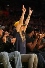 Kaley Cuoco attending a Los Angeles Lakers vs New York Knicks basketball game in LA on December 29, 2011