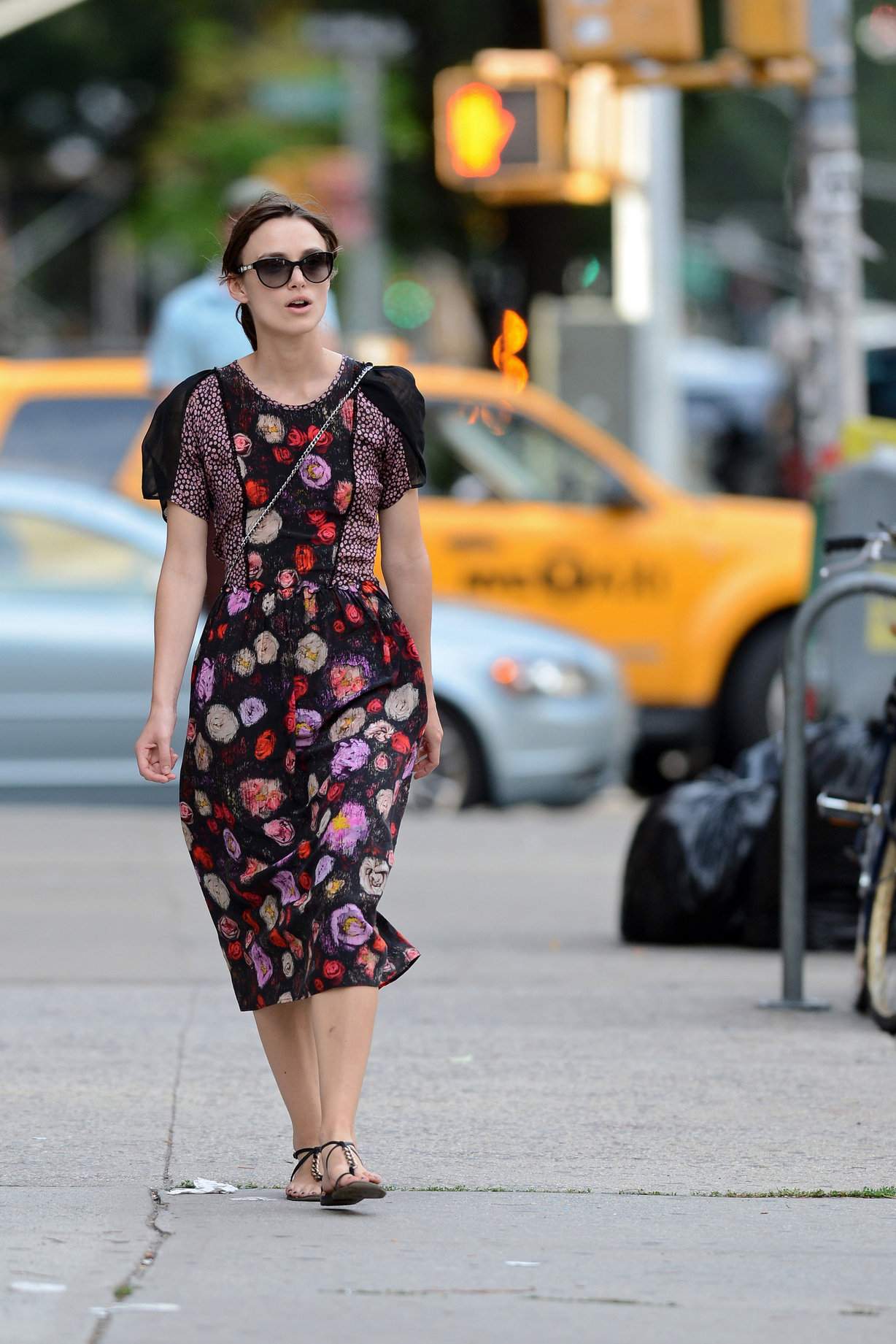 Keira Knightley wears a dark floral dress while strolling in New York City on August 7, 2012