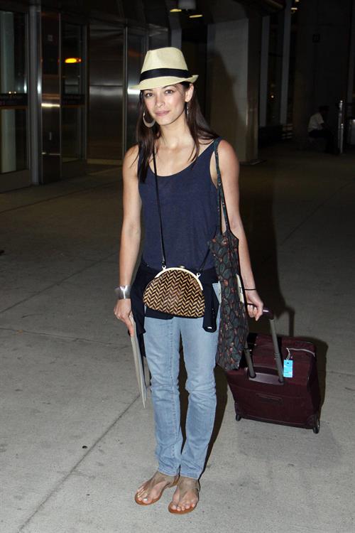 Kristin Kreuk - Pearson International Airport arrival candids in Toronto (July 16, 2012)