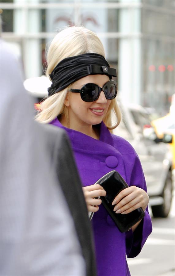 Lady Gaga holds her latest Vogue magazine cover September 2012 Issue close to her chest while out in New York City to visit a friend (07 August 2012).