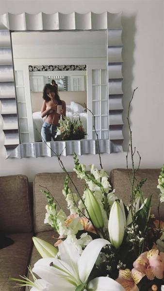 Emily Ratajkowski taking a selfie