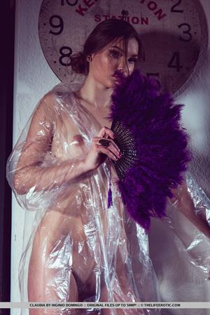 Claudia wraps her sexy, tight body on plastic as she plays with her pussy.