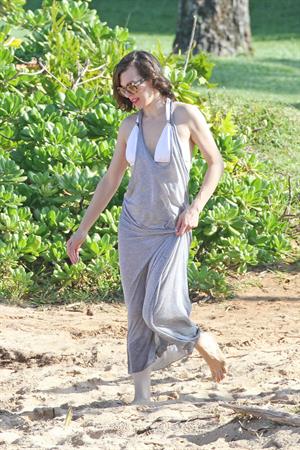 Milla Jovovich on the beach in a bikini on New Years Eve in Maui, Hawaii December 31, 2012 