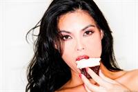 Tera Patrick takes off her black and white apron in the kitchen