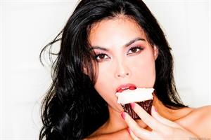 Tera Patrick Pictures Tera Patrick takes off her black and white apron in the kitchen