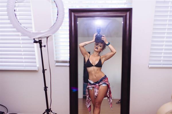 Tianna Gregory in a bikini taking a selfie