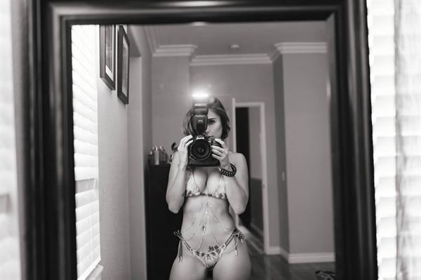 Tianna Gregory in a bikini taking a selfie