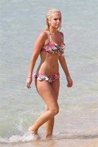 Tulisa Contostavlos Bikini Pictures Tulisa Contostavlos in a bikini on the beach in Honolulu July 31, 2012