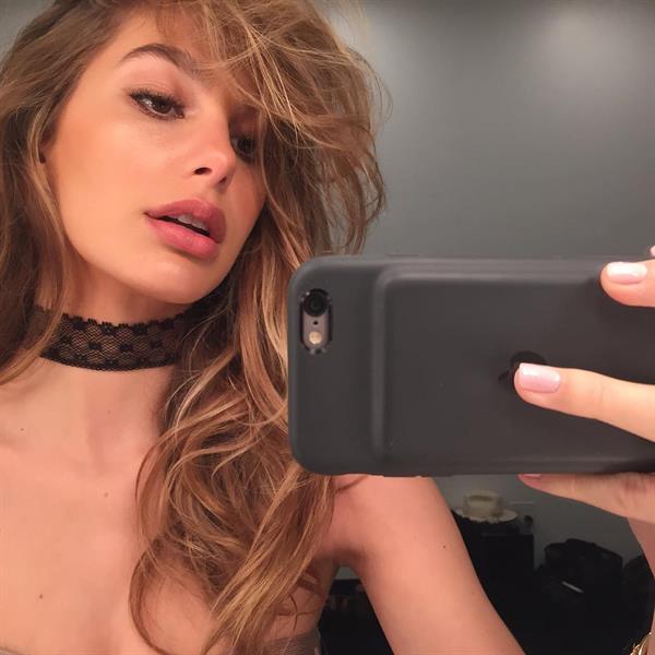 Camila Morrone taking a selfie
