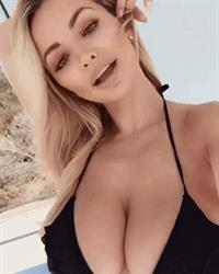 Lindsey Pelas in a bikini taking a selfie
