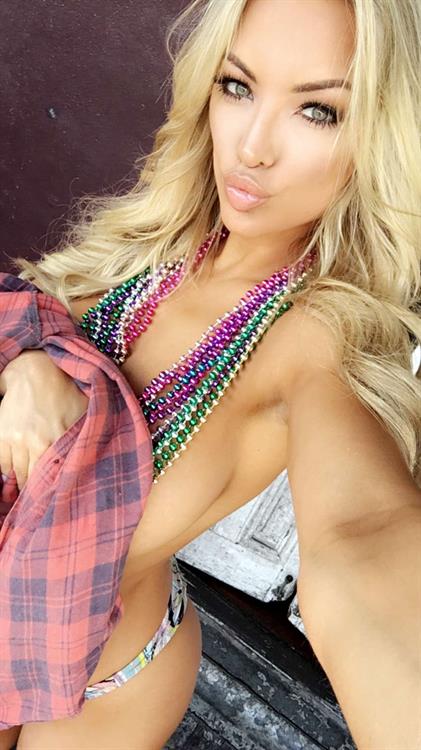 Lindsey Pelas in a bikini taking a selfie