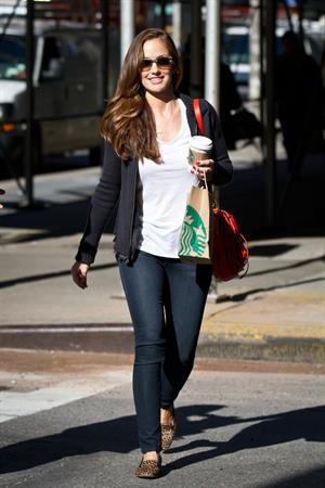 Minka Kelly outside her hotel with her morning Starbucks in New York City 8/2/2012 