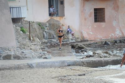 Kimberley Garner in a black bikini on the beach in St. Tropez on July 31, 2014