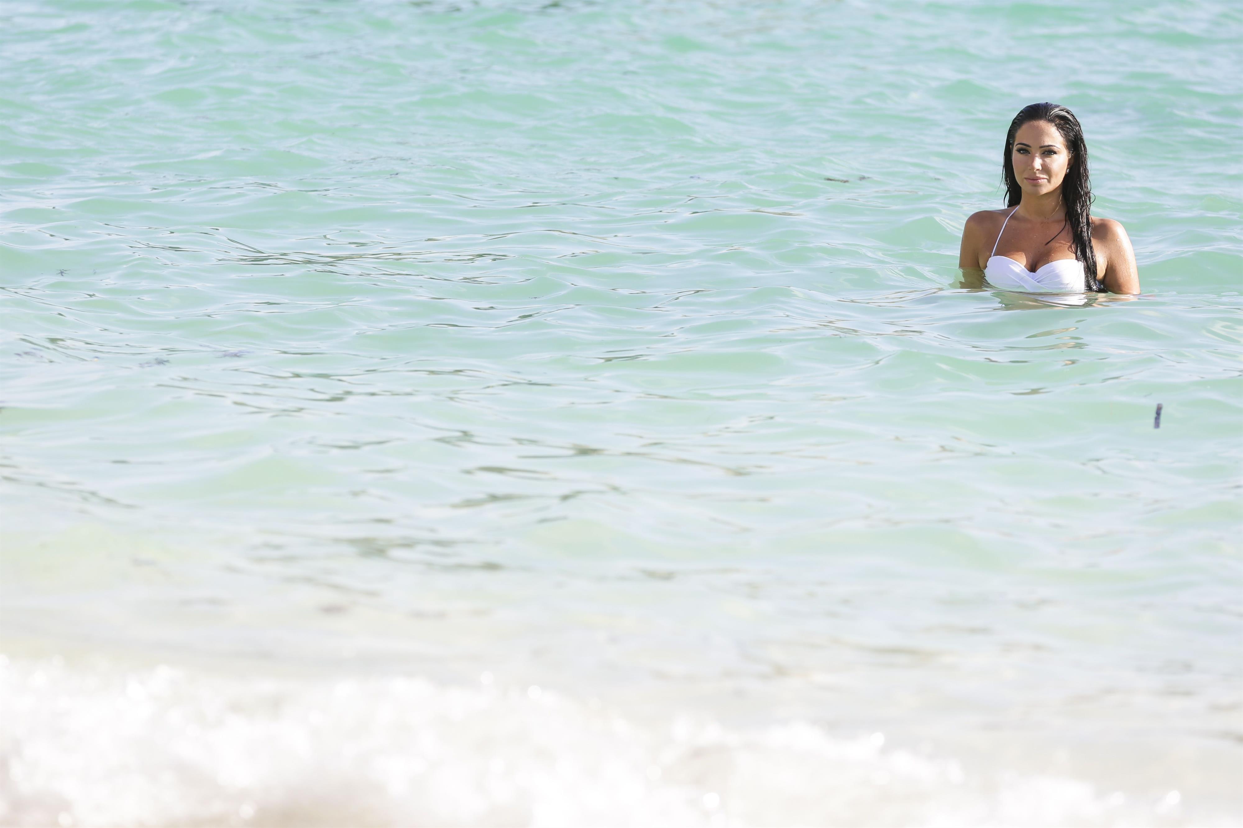 Tulisa Contostavlos in a bikini on the beach in Bermuda August 21, 2014