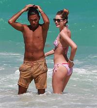 Doutzen Kroes enjoys a day on the beach in Miami Beach, FL on April 28, 2013