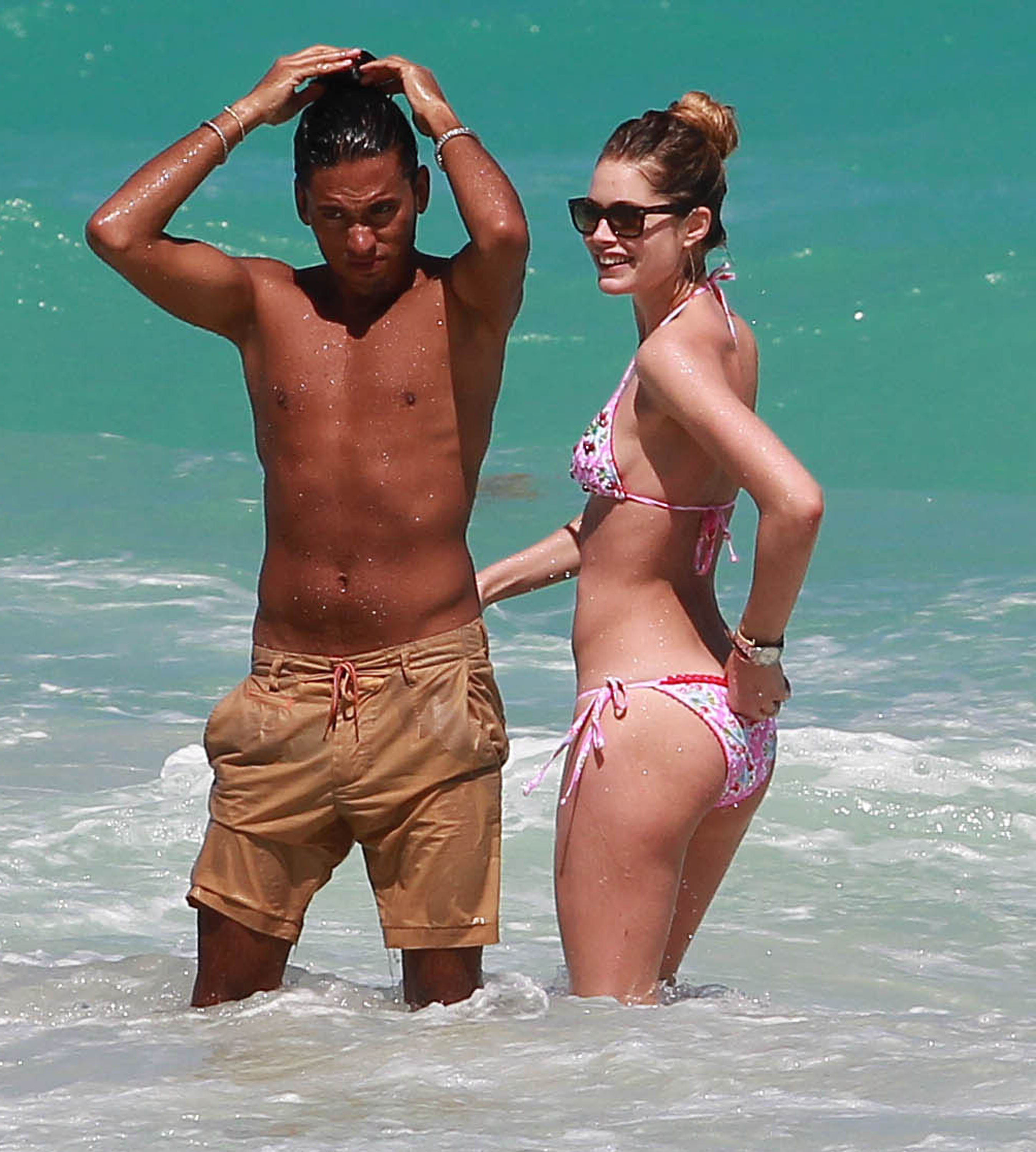 Doutzen Kroes enjoys a day on the beach in Miami Beach, FL on April 28, 2013