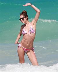 Doutzen Kroes enjoys a day on the beach in Miami Beach, FL on April 28, 2013