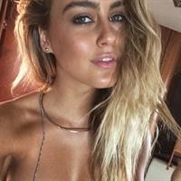 Stephanie Claire Smith in a bikini taking a selfie