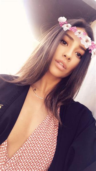 Shay Mitchell taking a selfie