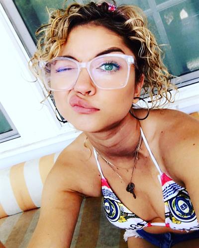 Sarah Hyland in a bikini taking a selfie