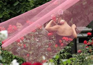 Natalie Portman modeling for a Miss Dior campaign photo shoot in the gardens of the Palais Royal in Paris 6/26/12 