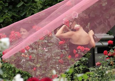 Natalie Portman modeling for a Miss Dior campaign photo shoot in the gardens of the Palais Royal in Paris 6/26/12 