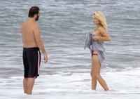 Pamela Anderson Pamela Anderson Going topless at the beach in France 02.10.13