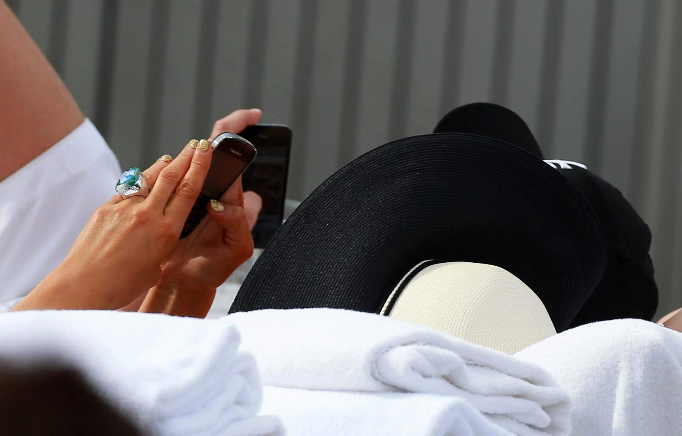 Paris Hilton spends the day in and out of the pool in Miami December 8, 2012