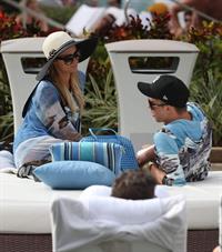 Paris Hilton spends the day in and out of the pool in Miami December 8, 2012