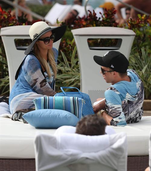 Paris Hilton spends the day in and out of the pool in Miami December 8, 2012