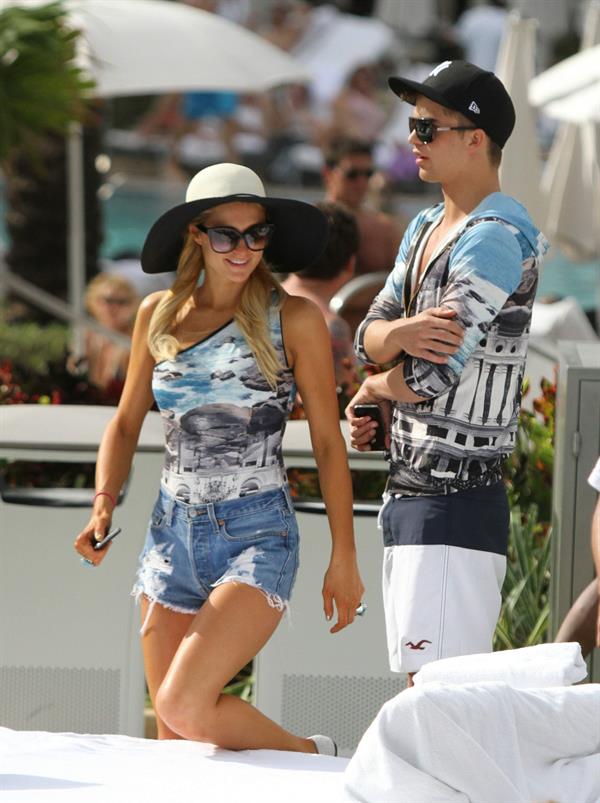 Paris Hilton spends the day in and out of the pool in Miami December 8, 2012