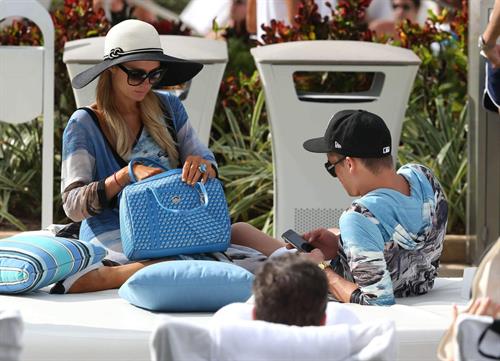 Paris Hilton spends the day in and out of the pool in Miami December 8, 2012