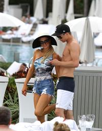 Paris Hilton spends the day in and out of the pool in Miami December 8, 2012