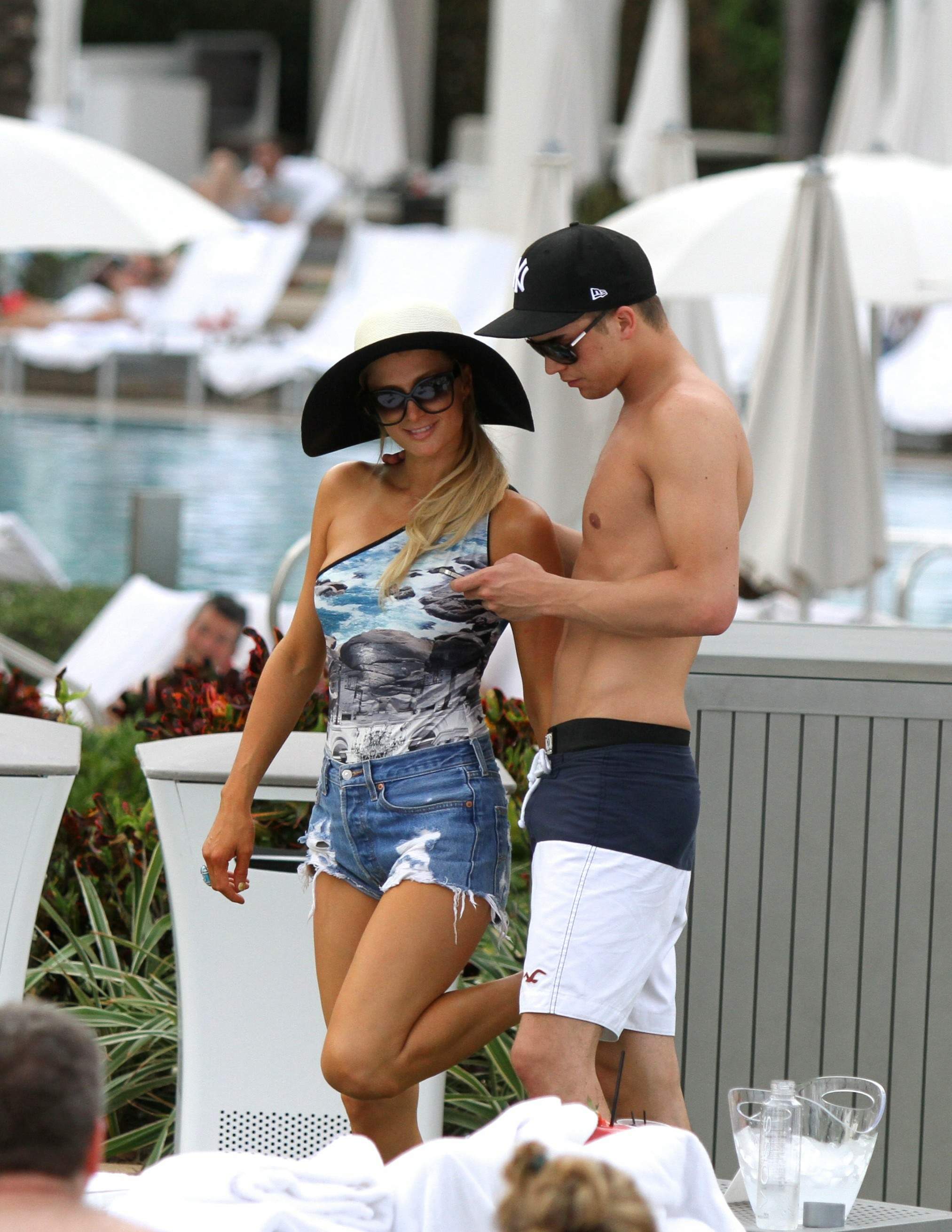 Paris Hilton spends the day in and out of the pool in Miami December 8, 2012