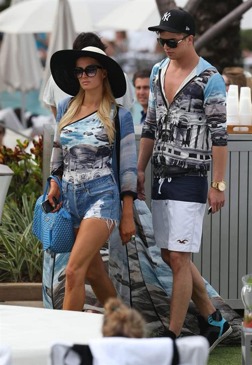 Paris Hilton spends the day in and out of the pool in Miami December 8, 2012
