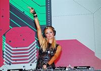 Paris Hilton walks for designer duo Shane and Falguni Peacock and performs as a DJ at the India Resort Fashion Week