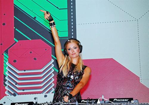 Paris Hilton walks for designer duo Shane and Falguni Peacock and performs as a DJ at the India Resort Fashion Week