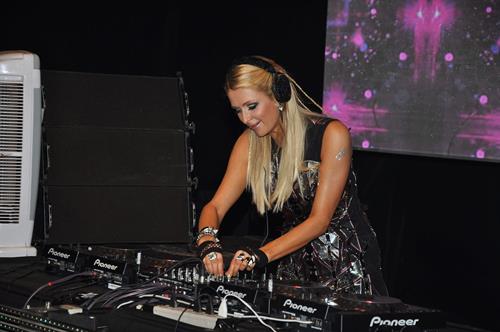 Paris Hilton walks for designer duo Shane and Falguni Peacock and performs as a DJ at the India Resort Fashion Week