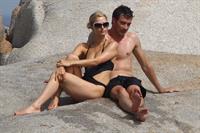 Paris Hilton - Wearing a swimsuit at a beach in France August 6, 2012