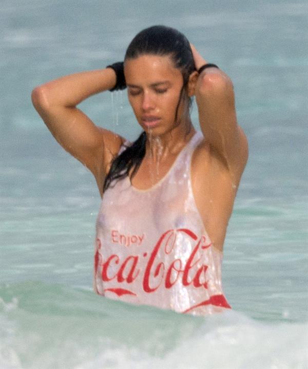 Adriana Lima – beach shoot candids in Cancun 12/2/13 